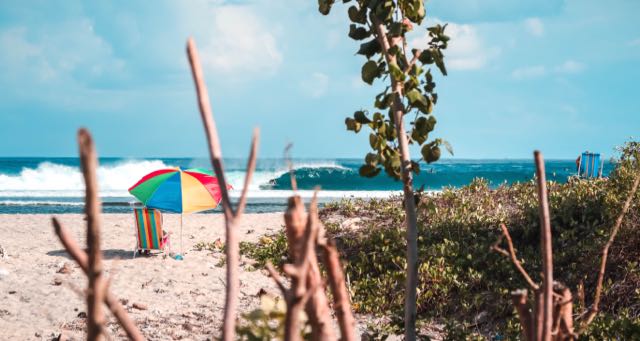 beach with chair and umbrella
