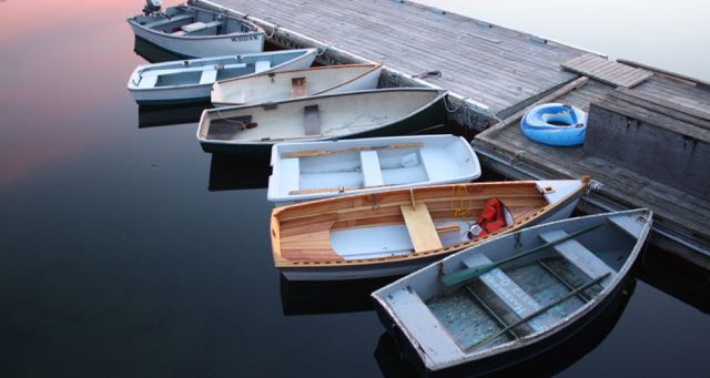 fishing boats tied to a pier