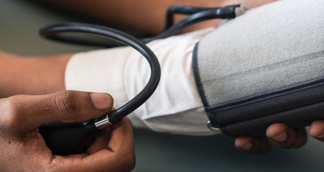 checking blood pressure