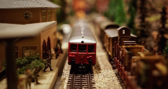 miniature train arriving at the station